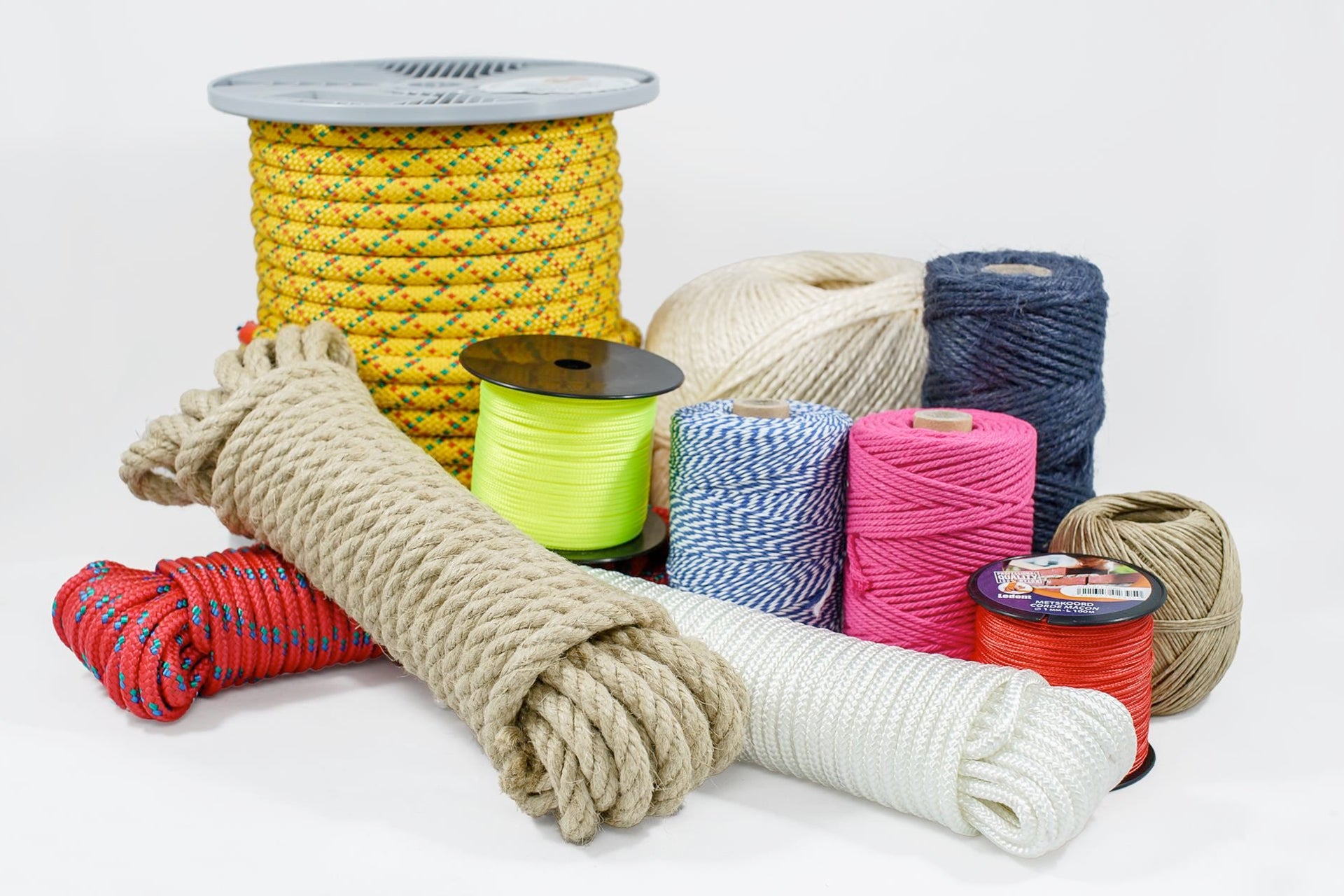Various ropes and cords in different colors, materials, and sizes displayed on a white background.